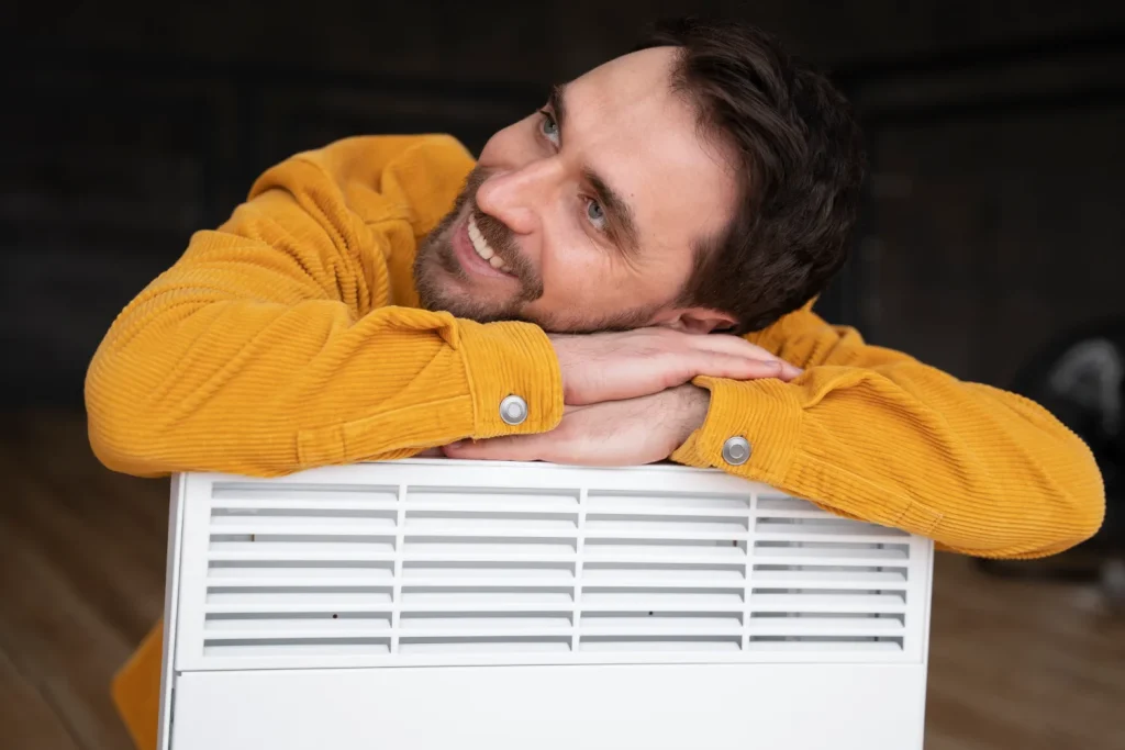 Homeowner checking HVAC air filters and ducts.