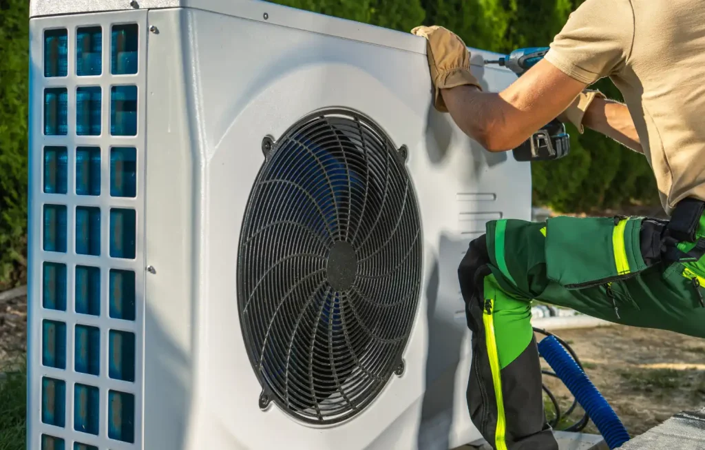 HVAC technician performing AC installation and maintenance services.