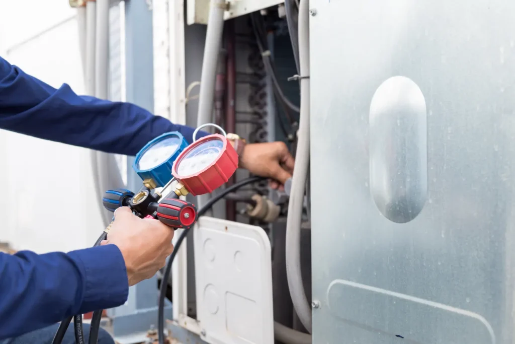 Technician performing maintenance on a heater for optimal performance and safety.